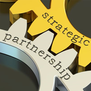 Homepage block showing to interlocking gears that say strategic partnerships